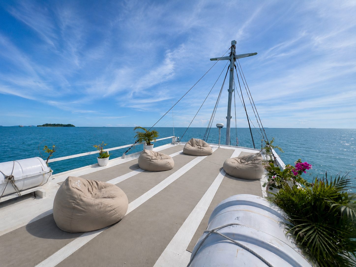 Bean bags on the bow deck under open sky