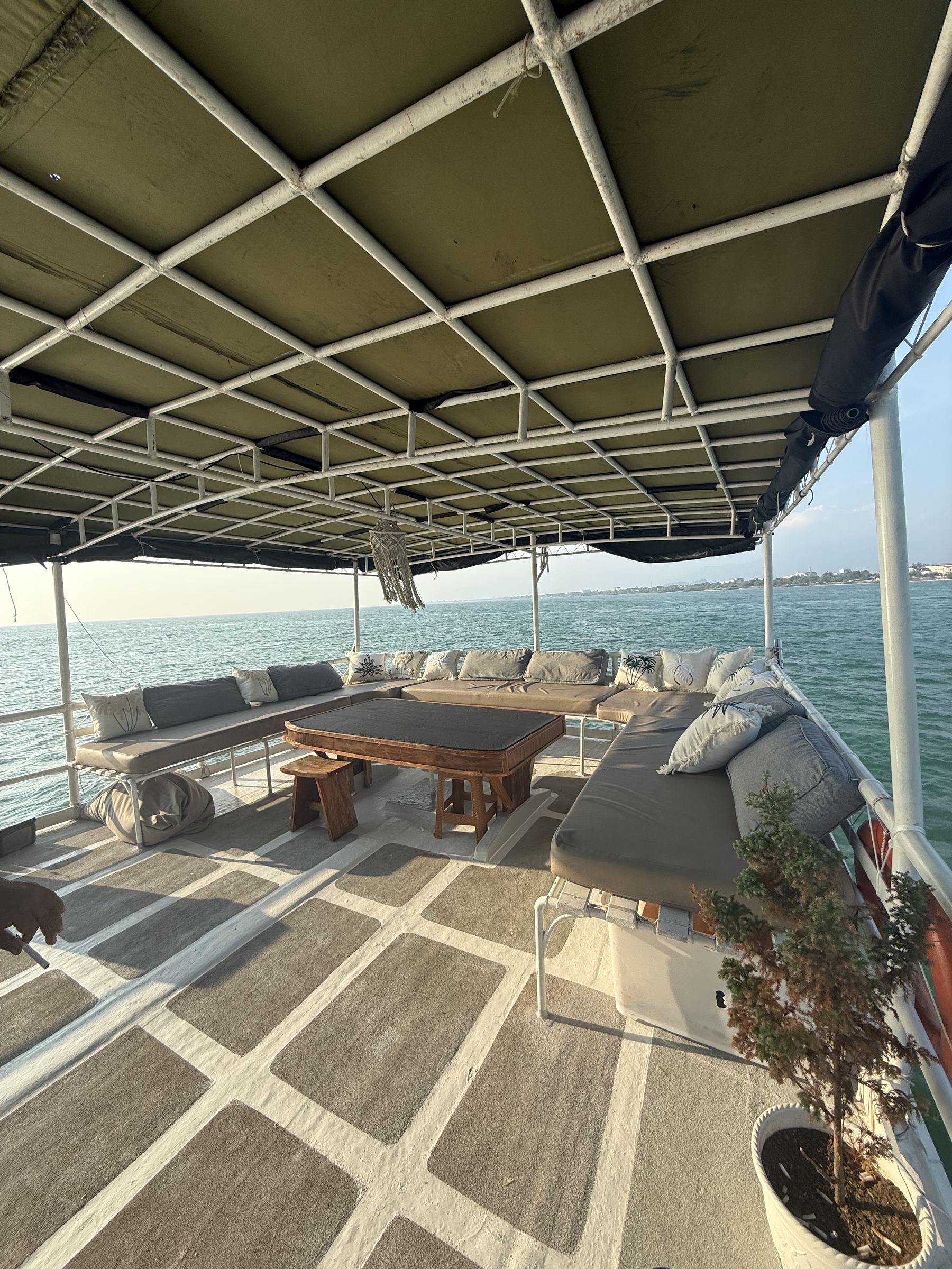 Deck lounge seating aboard Maki overlooking the sea