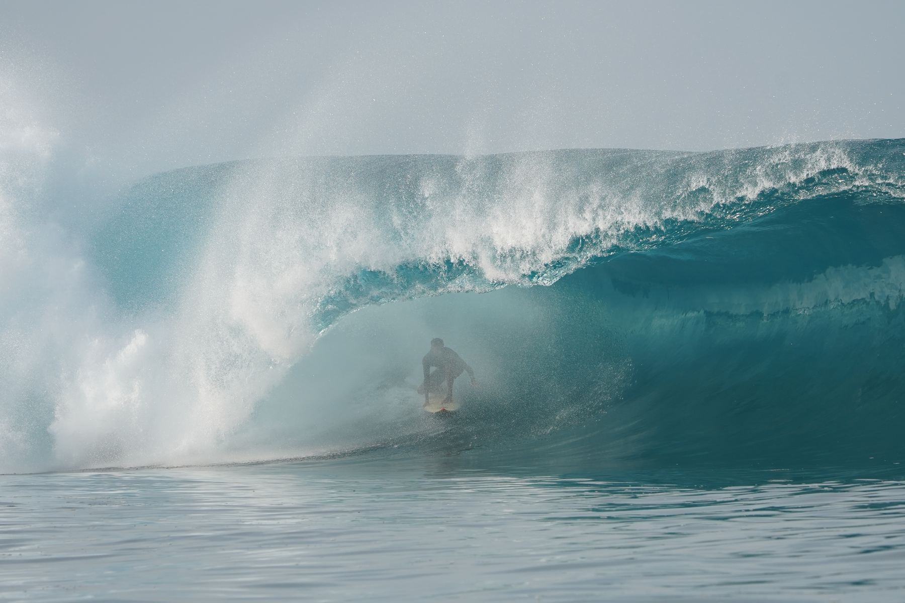 Surfer inside a misty Mentawai barrel
