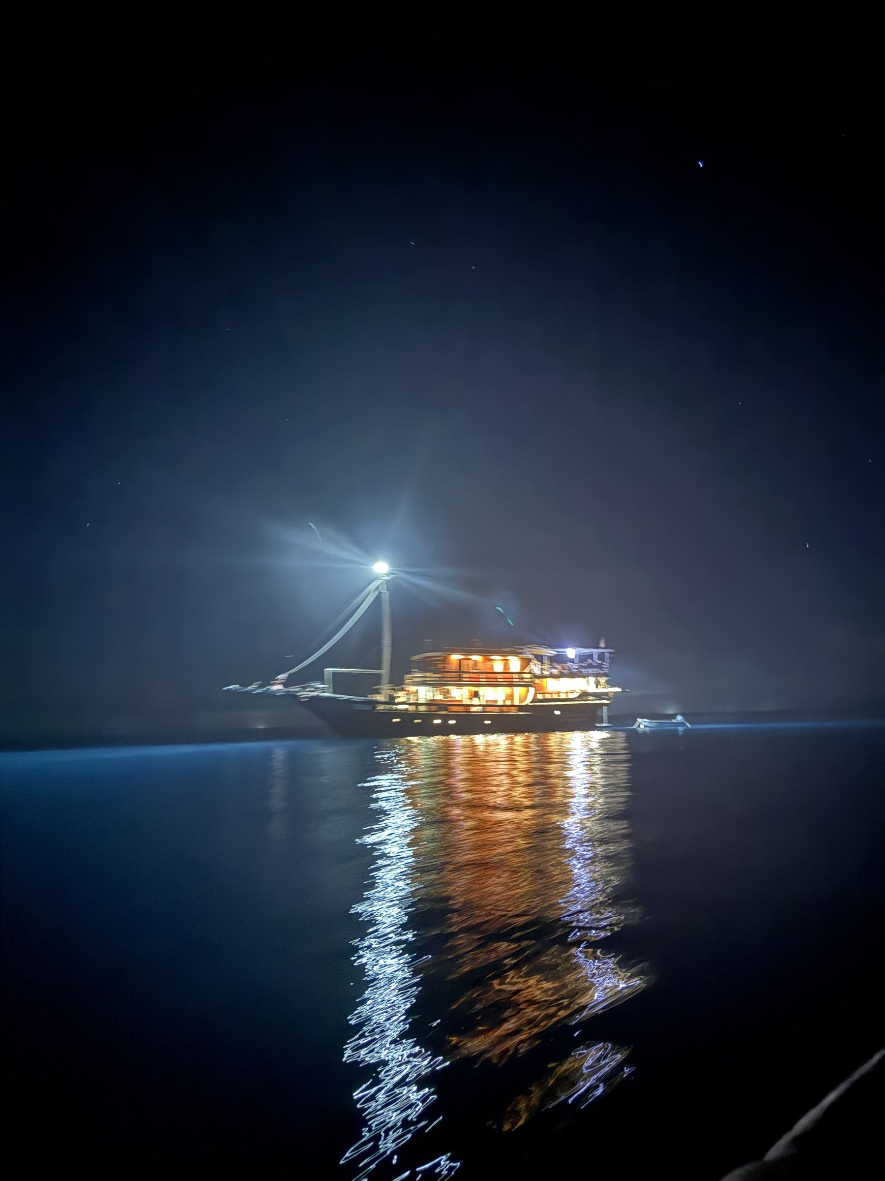 Maki lit up at anchor at night