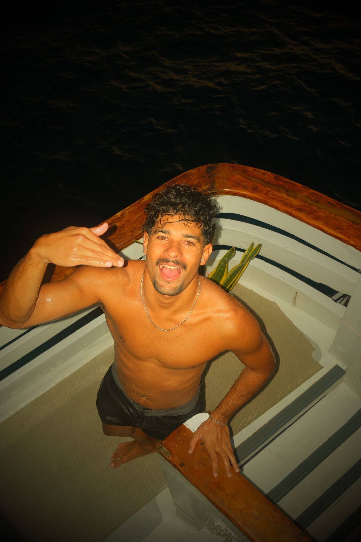 Guest giving a shaka after a night swim